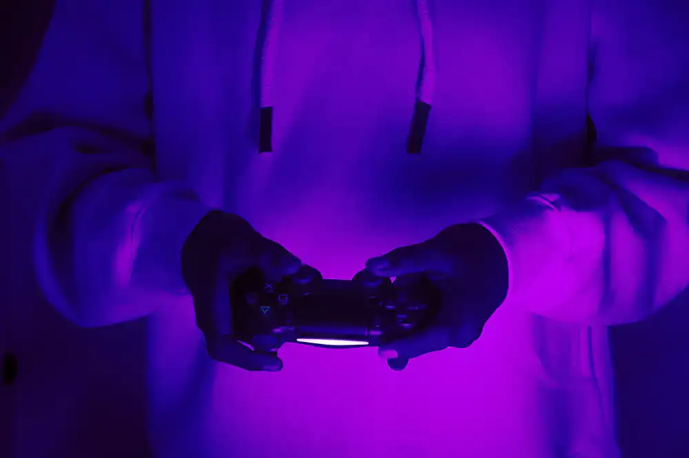 Close up of a player's hands on a rhythm game controller